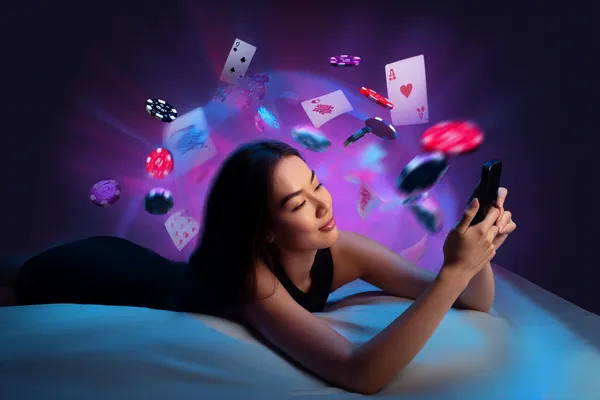 A young woman relaxing with her phone while dynamic casino elements float around her, illustrating the smooth mobile experience offered by the JILI7979 app.